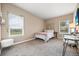 Cozy bedroom with natural light, featuring a desk, a bed, and modern decor at 1251 Double Eagle Ct, Castle Rock, CO 80104