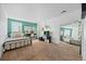Bright bedroom with stylish decor, including a desk, bed, and a large mirror feature at 1251 Double Eagle Ct, Castle Rock, CO 80104