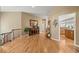 Inviting hallway with hardwood floors, decorative accents, and an open view into other rooms of the home at 1251 Double Eagle Ct, Castle Rock, CO 80104