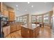 Spacious kitchen with a center island, granite countertops, and ample storage, seamlessly flowing into the dining area at 1251 Double Eagle Ct, Castle Rock, CO 80104