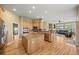 Open kitchen with a central island, granite countertops, and stainless steel appliances, seamlessly connected to the living area at 1251 Double Eagle Ct, Castle Rock, CO 80104