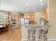 Spacious kitchen features granite counters, breakfast bar, and attached dining area at 1251 Double Eagle Ct, Castle Rock, CO 80104