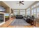 Comfortable living room featuring hardwood floors, fireplace, and bright, natural light at 1251 Double Eagle Ct, Castle Rock, CO 80104