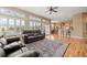 Open living area featuring hardwood floors, bar seating, and lots of natural light at 1251 Double Eagle Ct, Castle Rock, CO 80104