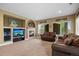 Inviting living room features a cozy fireplace, comfortable seating, and large windows for natural light at 1251 Double Eagle Ct, Castle Rock, CO 80104