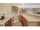 Modern wet bar featuring a sink, cabinets, countertop, and drink fridge at 1251 Double Eagle Ct, Castle Rock, CO 80104