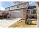 Two-story townhome featuring a private garage, a driveway and mature landscaping at 4042 E Geddes Cir, Centennial, CO 80122