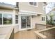 Back deck featuring sliding glass door with access to eat-in kitchen at 329 Lodgewood Ln, Lafayette, CO 80026