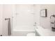 Clean and modern bathroom with white tile, contemporary fixtures, and vanity at 329 Lodgewood Ln, Lafayette, CO 80026