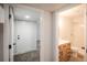 Bathroom entryway featuring a new vanity and shower with a glass door at 329 Lodgewood Ln, Lafayette, CO 80026