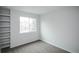 A bedroom with built in shelving and a view to the outside at 329 Lodgewood Ln, Lafayette, CO 80026