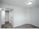 Bedroom with neutral carpet, spacious closet, and fresh white paint at 329 Lodgewood Ln, Lafayette, CO 80026