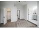 A bedroom with a vaulted ceiling includes a closet, bathroom, and multiple doorways at 329 Lodgewood Ln, Lafayette, CO 80026