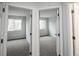 Two bright bedrooms with plush carpeting and natural light from large windows at 329 Lodgewood Ln, Lafayette, CO 80026