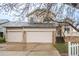 Charming two-story home with a three-car garage and a covered front porch at 329 Lodgewood Ln, Lafayette, CO 80026