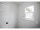 Bright laundry room features a window and a door at 329 Lodgewood Ln, Lafayette, CO 80026