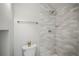The bathroom shower is tiled in neutral colors at 329 Lodgewood Ln, Lafayette, CO 80026
