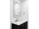 Modern bathroom with LED mirror, dark wood vanity, and a sleek countertop, perfect for everyday use at 12680 W 38Th Dr, Wheat Ridge, CO 80033