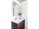 Clean bathroom with dark wood vanity, updated sink and faucet, and stylish white countertop at 12680 W 38Th Dr, Wheat Ridge, CO 80033
