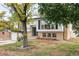 Charming home featuring a well-maintained yard, a two-car garage, and a classic exterior design at 12680 W 38Th Dr, Wheat Ridge, CO 80033