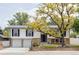 Charming home featuring a well-maintained yard, a two-car garage, and a classic exterior design at 12680 W 38Th Dr, Wheat Ridge, CO 80033