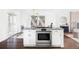Modern kitchen design with stainless steel oven, granite countertops and white cabinetry, great for cooking at 12680 W 38Th Dr, Wheat Ridge, CO 80033