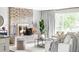 Bright living room with a decorative fireplace, stylish furnishings, and ample natural light at 12680 W 38Th Dr, Wheat Ridge, CO 80033