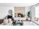 Bright living room with a decorative fireplace, stylish furnishings, and ample natural light at 12680 W 38Th Dr, Wheat Ridge, CO 80033