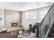 Inviting living room featuring a cozy fireplace and plenty of natural light at 12680 W 38Th Dr, Wheat Ridge, CO 80033
