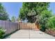 A backyard concrete driveway and fence provides parking and privacy in the outdoor area at 4032 Lipan St, Denver, CO 80211