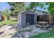 A backyard shed and picnic table, offering practical storage and a relaxing outdoor seating area at 4032 Lipan St, Denver, CO 80211