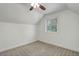 Simple bedroom with neutral carpet, white walls, a window, and a ceiling fan at 4032 Lipan St, Denver, CO 80211
