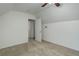 Simple bedroom with neutral carpet and white walls with connecting room at 4032 Lipan St, Denver, CO 80211