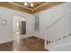 Bright dining room boasts hardwood floors, a decorative ceiling, and an arched entryway to the kitchen at 4032 Lipan St, Denver, CO 80211