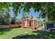 An exterior view of the home showing the backyard, patio, shed and upper-level deck at 4032 Lipan St, Denver, CO 80211