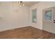 Sunny living room features hardwood floors, natural light, and access to the front door at 4032 Lipan St, Denver, CO 80211