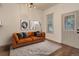 Living room featuring a comfortable sofa, natural light, and hardwood floors at 4032 Lipan St, Denver, CO 80211
