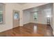 Bright living room with hardwood floors, fresh paint, and original stained-glass front door at 4032 Lipan St, Denver, CO 80211