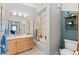 Bright bathroom with a tub and shower combination, vanity, and neutral tile flooring at 3299 Lowell Blvd # 102, Denver, CO 80211
