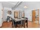 Dining room with a dark wood table, seating for eight, and wood floors at 3299 Lowell Blvd # 102, Denver, CO 80211