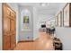 Hallway features wood floors and an arched display nook with artwork and decorative items at 3299 Lowell Blvd # 102, Denver, CO 80211