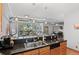 Kitchen with bar seating overlooks the living area and windows at 3299 Lowell Blvd # 102, Denver, CO 80211