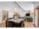 Open living space combining the kitchen, living area, and dining room at 3299 Lowell Blvd # 102, Denver, CO 80211