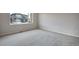 Bedroom with neutral carpet, with a bright window view at 3443 N Gold Bug Ct, Aurora, CO 80019
