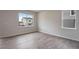 Bedroom featuring wood floors with a view of the neighborhood at 3443 N Gold Bug Ct, Aurora, CO 80019