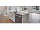 Bright kitchen with a central island, stainless steel appliances, and scenic backyard views at 3443 N Gold Bug Ct, Aurora, CO 80019