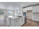Modern kitchen with ample storage space, stainless steel appliances, and an island with a sink at 3443 N Gold Bug Ct, Aurora, CO 80019