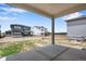 Covered patio with concrete flooring and views of the backyard at 3443 N Gold Bug Ct, Aurora, CO 80019