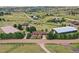 Aerial view of horse property featuring paddocks and training area at 10325 Cherrywood Dr, Parker, CO 80138