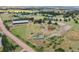 This aerial image shows the layout of the horse property with paddocks, outbuildings, and riding arena at 10325 Cherrywood Dr, Parker, CO 80138